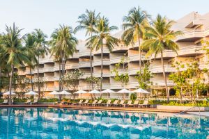 Beautiful luxury outdoor swimming pool with umbrella and chair in hotel pool resort - Vintage light Filter